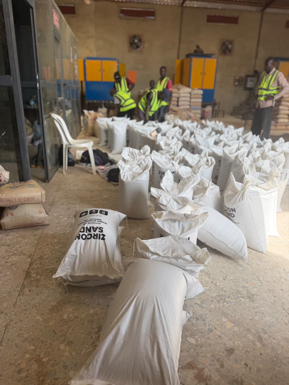 Rows of filled zircon sand bags across the plant floor