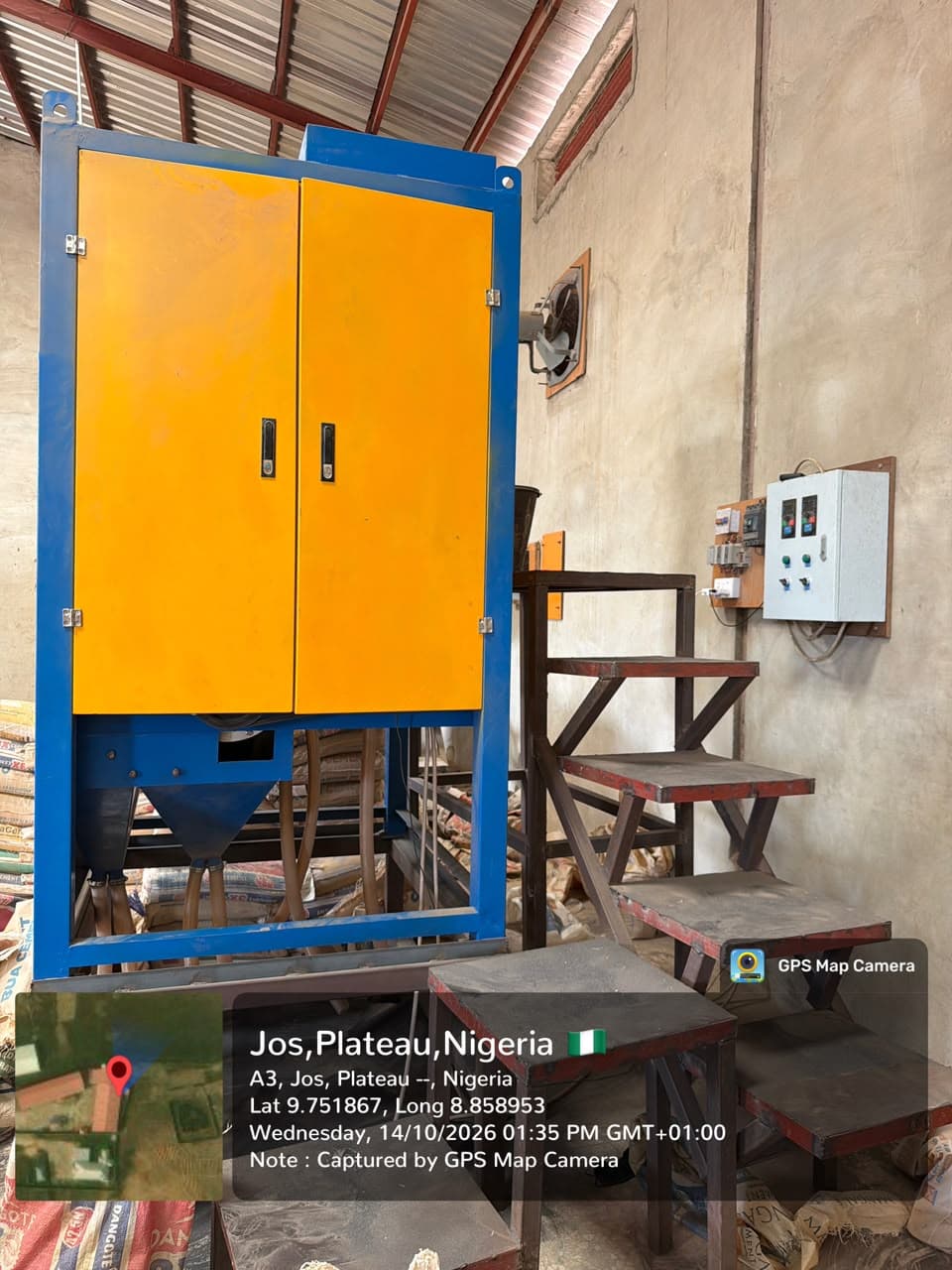 Yellow and blue separator cabinet beside its access steps