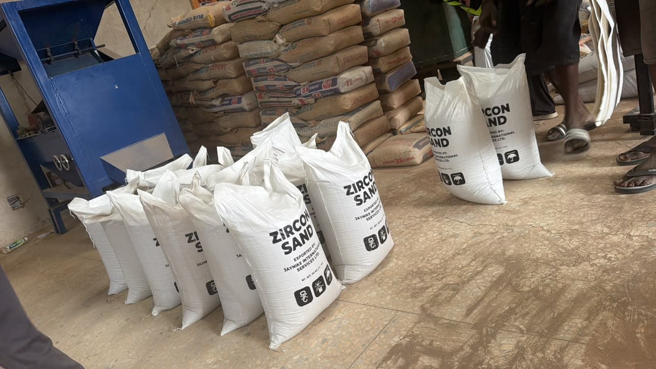 Branded zircon sand bags lined up beside the plant equipment